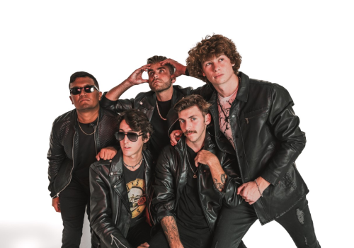 Five individuals wearing black leather jackets pose together against a white background, with some gazing into the distance and one wearing sunglasses.