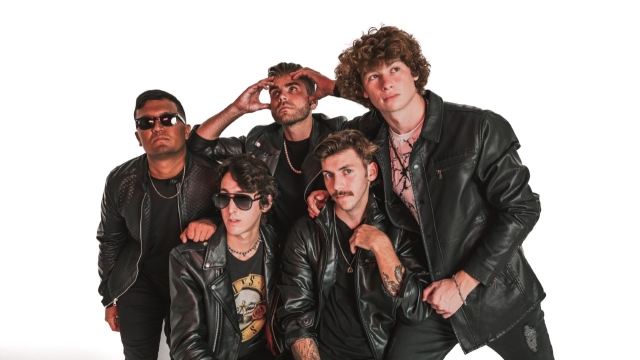 Five individuals wearing black leather jackets pose together against a white background, with some gazing into the distance and one wearing sunglasses.