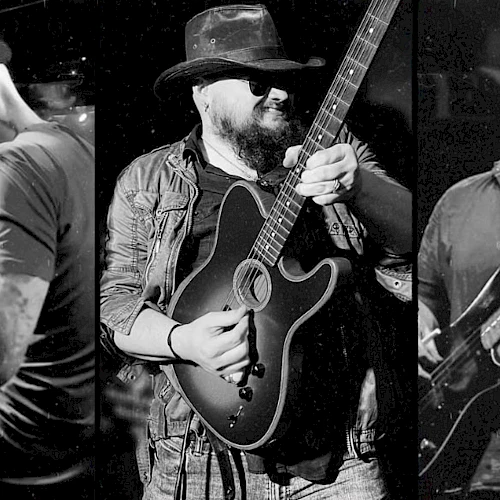 The image shows three musicians performing: a drummer, a guitarist with a hat, and another guitarist wearing sunglasses, captured in black and white.