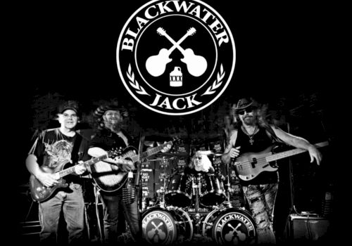 Blackwater Jack rock band logo&mdash;crossed guitars over a live stage with musicians playing and Bud Light beers on barrels.